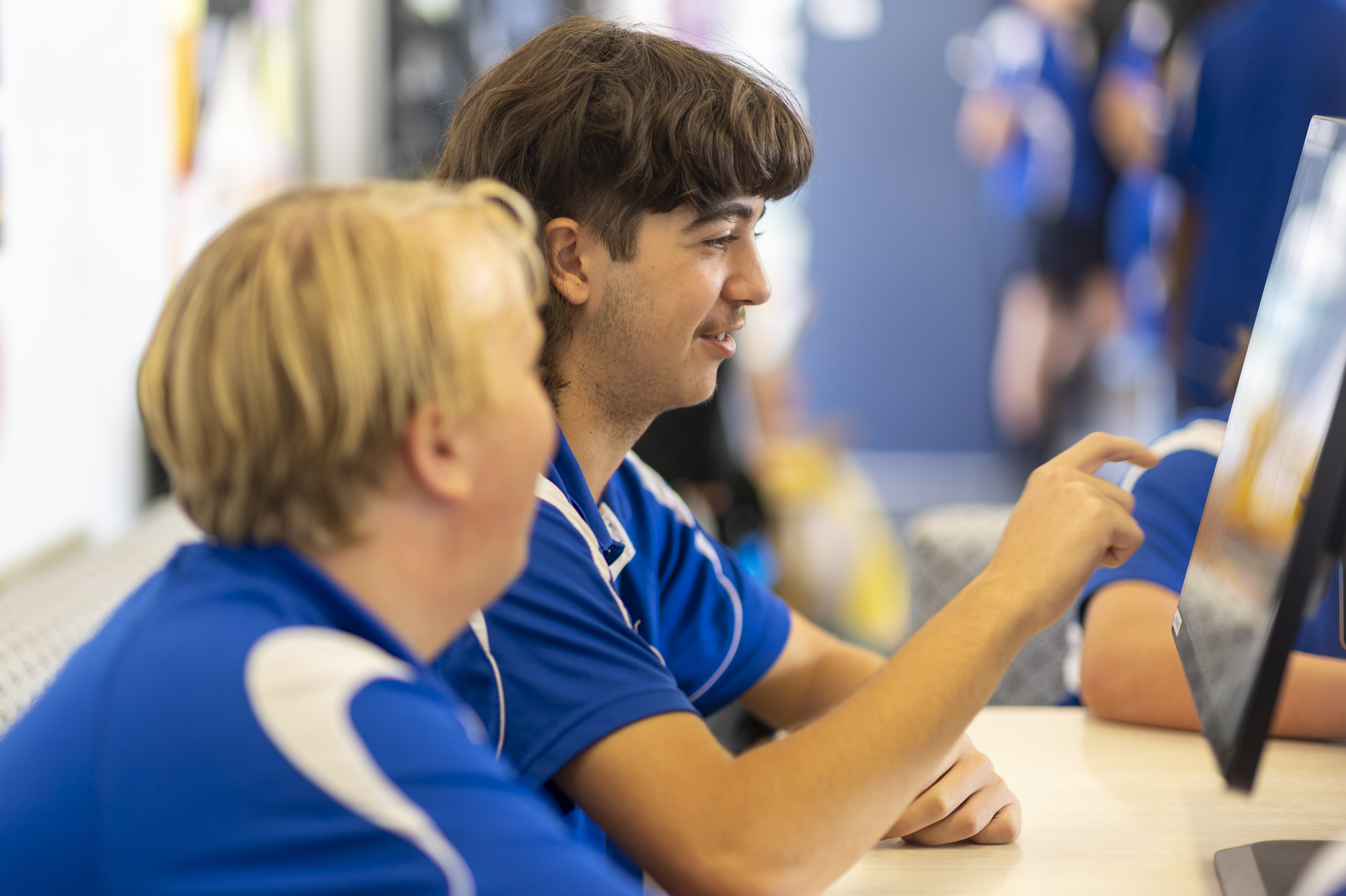 Two students using game screen. 